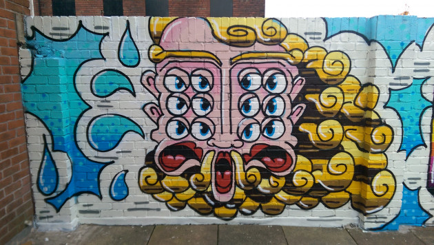 Mural of a multi-eyed deity